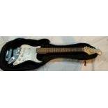 A FENDER Squire STRAT electric guitar, black body, rosewood neck with TGI soft case