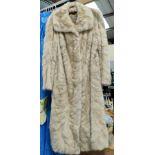 A blonde full length fur coat, medium