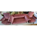 An early 20th century drop arm three seater settee, covered in pink draylon velvet and a pair of ma