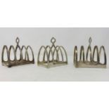 Three hallmarked silver 4 division toast racks, Birmingham 1931 - 24, length 8cm, maker E Viner, 5.