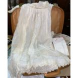 A 19th century christening dress; lace and linen; A pair of WWII flying boots etc;