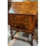 A 1930's ladies burr walnut bureau in the Georgian style with fall front