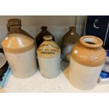 A selection of stoneware advertising jugs