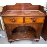 An Edwardian mahogany washstand with 2 drawers and arched undershelf