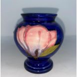 A Moorcroft small vase of inverted baluster form, decorated with magnolia