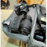 A LUMIX SLR camera with spare lenses, bag etc; a 9-30 x 40mm Telesport 300m telescope