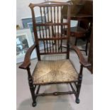 A 19th century Lancashire armchair with spindle back and rush seat
