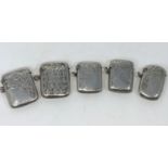 Five early 20th century hallmarked silver vesta cases with chased decoration, various dates