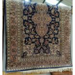 A modern hand knotted Persian rug with central medallion on blue ground, and allover decoration of