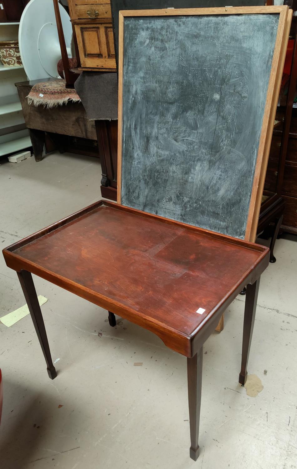 An easel blackboard; a folding bedtable