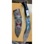 A Kukri in white metal presentation sheath