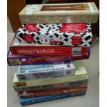 A large quantity of jigsaw puzzles