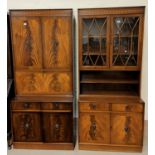 A reproduction pair of mahogany full height wall units with cupboards, drawers and shelves