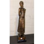 After Chiparus: a modern bronze depicting a woman in 1930's attire, height 49 cm
