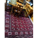 A modern large Bokhara carpet, hand knotted, with red ground, 425 x 248 cm