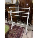 An Edwardian wall cupboard, cream painted with leaded glass; a white towel rail