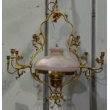 A Victorian style large ornate brass oil lamp/chandelier with 6 brass side sconces
