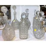 Three pairs of cut glass decanters