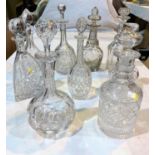 Ten various cut glass decanters