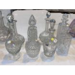 Seven various cut glass decanters