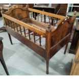 A baby's stained wood cot in the continental style, 115 x 64 cm