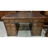 An early 20th century stained wood pedestal desk fitted 9 drawers, inset leather top, 134 x 76 cm