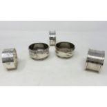 Three hallmarked silver napkin rings; a pair of hallmarked silver salts (no liners); various dates