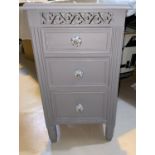 A three height bedside chest painted in grey; a nest of teak tables with smokey glass tops