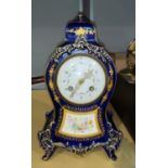 A Louis XVI style mantel clock in blue porcelain case with hand painted floral decoration painted