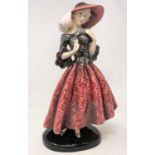 An Art Deco figure, Goldscheider, Wien, depicting a woman in hat and flowing dress, height 37 cm (