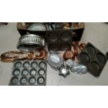A selection of decorative china and glass; a selection of copper jelly moulds; vintage cake tins;