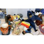 A Royal Crown Derby cat; a Guinness toucan; a novelty 'Bellboy' teapot; china animals; a selection