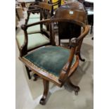 An early 20th century office swivel armchair; a reproduction mahogany wine table