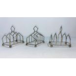 Three hallmarked silver small 4 division toast racks, Birmingham 1931 / 2 / 3, length 3.5cm, by