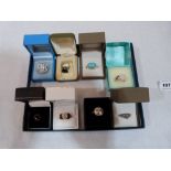 Eight gem set silver rings