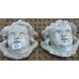 A pair of cherubic mask garden wall plaques. 8' high