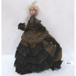 A Victorian doll with composition head, wired limbs and lace trimmed satin dress. 10' high