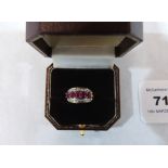 A ruby and white stone ring. In gold marked 9K. 2.4 g gross. Size M