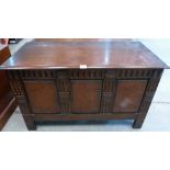 An oak chest with three panel front on stiles. 42' wide