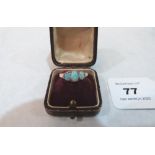 A three stone opal ring. In gold but apparently unmarked. 2.6g gross. Size N½