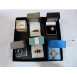 Six silver gem set rings