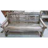 A teak garden bench. 60' wide