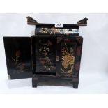 A Japanese lacquer table cabinet, the interior with seven drawers enclosed by a pair of doors. 14'
