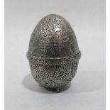 A white metal egg form pin cushion, chased with foliage, the base stamped AEW. 1¾' high