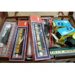 A case and a box of Model railway OO carriages and rolling stock