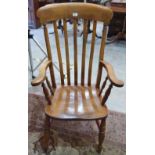 A Victorian elm and ash lath back elbow chair
