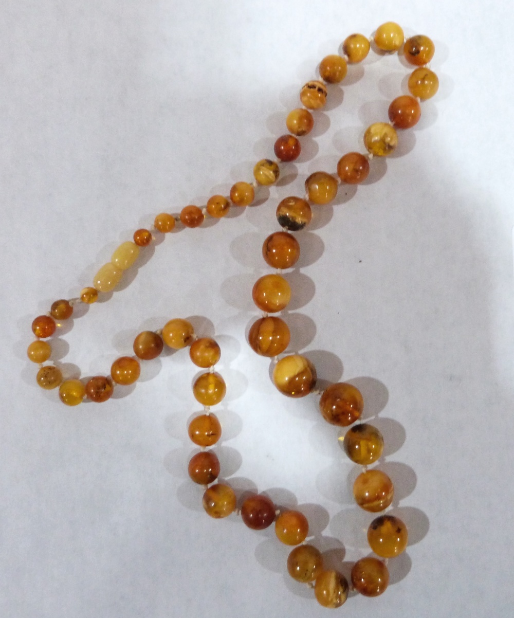 A necklace of graduated amber beads. 34.8g gross. 24' long