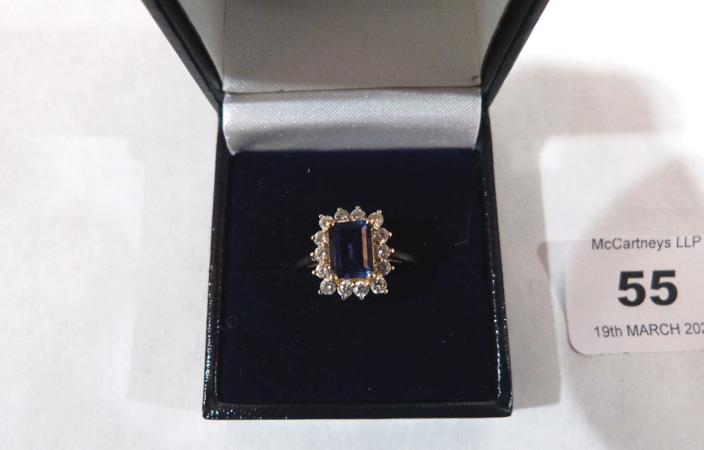 A sapphire and white stone cluster ring. In gold marked 585. 3.4g gross. Size S