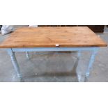 A pine kitchen table on painted turned legs. 54' long