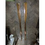 A pair of vintage oars. 59' long